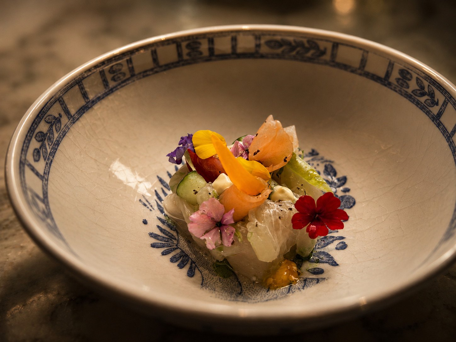 Artfully presented fish first course at a private dinner by Marius Mutschinski